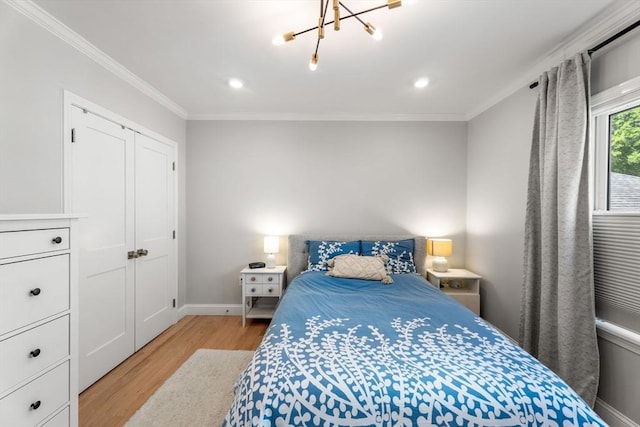 172 Orchard St Unit 172, Watertown, MA 02472 - bedroom featuring light wood-style floors, ornamental molding, baseboards, recessed lighting, and a chandelier