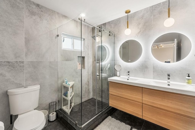 172 Orchard St Unit 172, Watertown, MA 02472 - bathroom with tile walls, tile patterned flooring, double vanity, toilet, and a shower stall