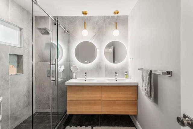 172 Orchard St Unit 172, Watertown, MA 02472 - bathroom featuring double vanity, a shower stall, and tile patterned flooring