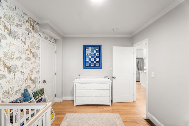 172 Orchard St Unit 172, Watertown, MA 02472 - bedroom with light wood-type flooring, baseboards, and ornamental molding