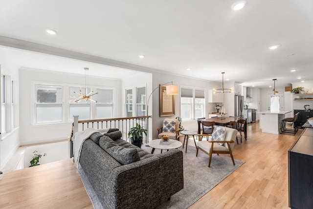 172 Orchard St Unit 172, Watertown, MA 02472 - living room with a chandelier, light wood-type flooring, recessed lighting, and crown molding