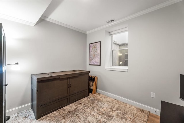 172 Orchard St Unit 172, Watertown, MA 02472 - bedroom featuring crown molding, baseboards, and wood finished floors