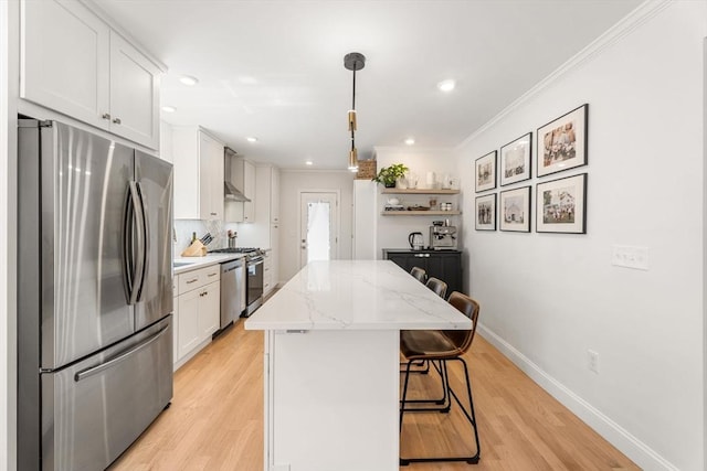 172 Orchard St Unit 172, Watertown, MA 02472 - kitchen with stainless steel appliances, a center island, a kitchen bar, white cabinetry, and open shelves