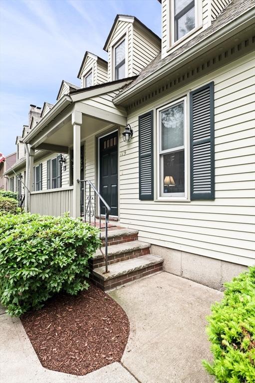 119 Wellman Ave Unit 119, Chelmsford, MA 01863 - view of exterior entry featuring covered porch