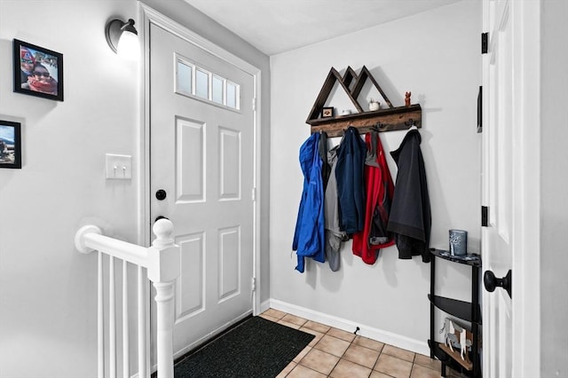 119 Wellman Ave Unit 119, Chelmsford, MA 01863 - entryway with baseboards and light tile patterned floors