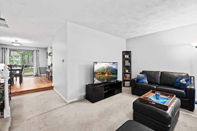 119 Wellman Ave Unit 119, Chelmsford, MA 01863 - carpeted living room featuring baseboards