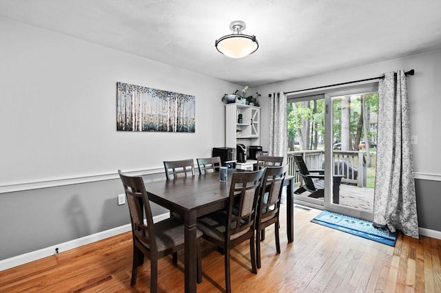 119 Wellman Ave Unit 119, Chelmsford, MA 01863 - dining room featuring baseboards and wood-type flooring