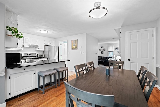 119 Wellman Ave Unit 119, Chelmsford, MA 01863 - dining area with light wood finished floors and baseboards