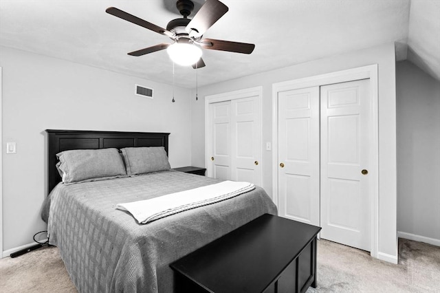 119 Wellman Ave Unit 119, Chelmsford, MA 01863 - bedroom featuring light carpet, multiple closets, baseboards, and a ceiling fan