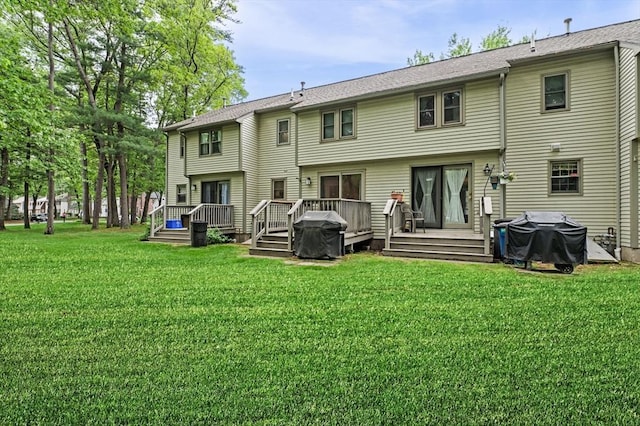 119 Wellman Ave Unit 119, Chelmsford, MA 01863 - back of property featuring a lawn and a deck