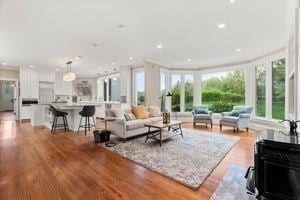 living room with wood finished floors and recessed lighting