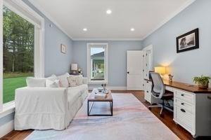 living room featuring ornamental molding, a desk, healthy amount of natural light, dark wood-type flooring, and recessed lighting