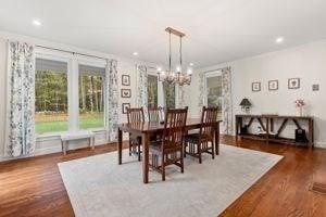 dining room featuring a chandelier, dark wood-style floors, and recessed lighting