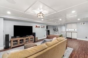 living room featuring recessed lighting, baseboards, and wood finished floors