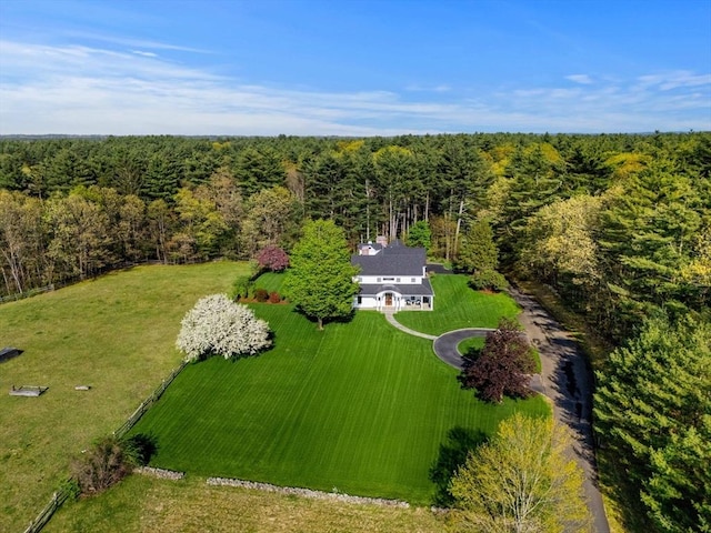 view from above of property with a heavily wooded area