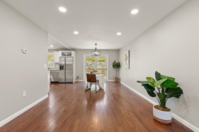 dining space featuring dark wood-style flooring, recessed lighting, and baseboards