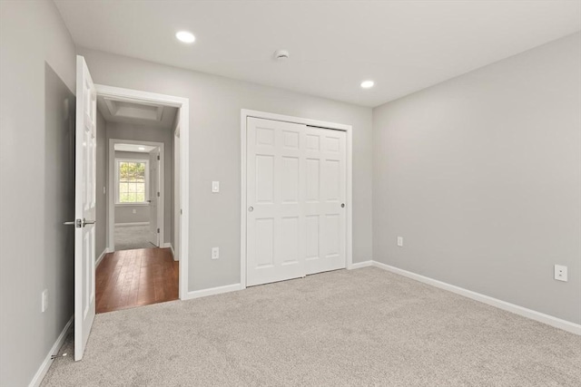 unfurnished bedroom featuring carpet floors, recessed lighting, and baseboards