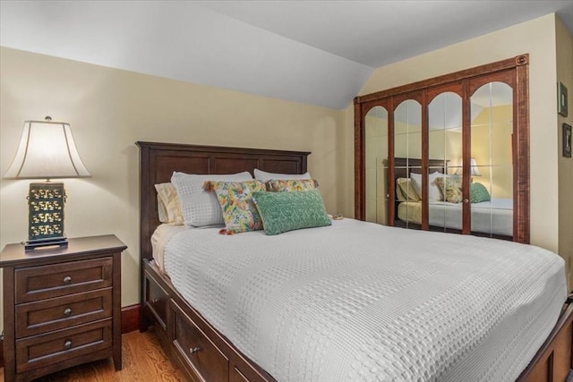 100 Williams Ave, Boston, MA 02136 - bedroom featuring wood finished floors, lofted ceiling, and access to outside
