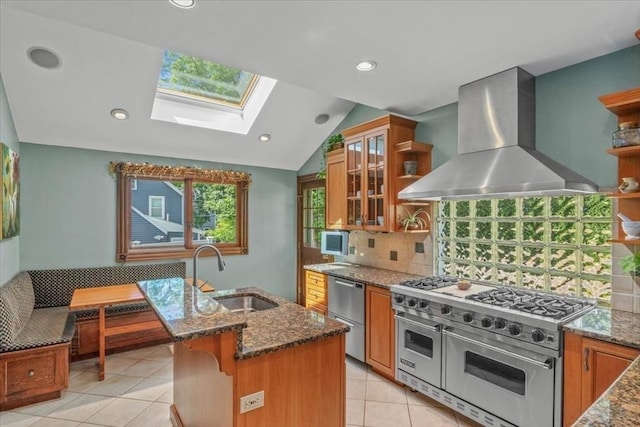 100 Williams Ave, Boston, MA 02136 - kitchen featuring appliances with stainless steel finishes, island exhaust hood, a skylight, brown cabinetry, and open shelves