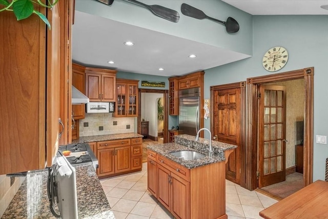 100 Williams Ave, Boston, MA 02136 - kitchen featuring range hood, stainless steel built in refrigerator, brown cabinets, backsplash, and recessed lighting