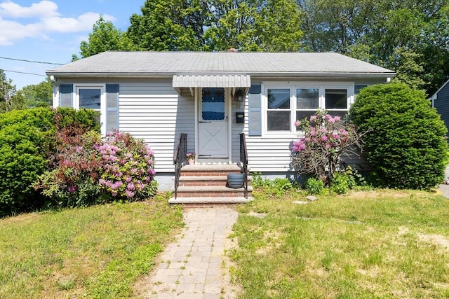 50 Elmwood Rd, Methuen, MA 01844 - bungalow-style home featuring a front lawn and roof with shingles