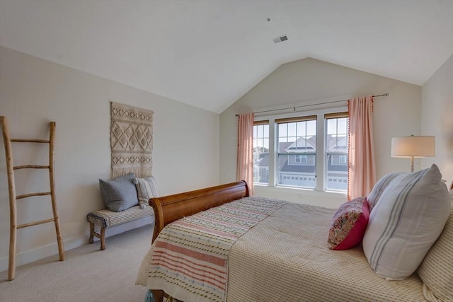 bedroom with baseboards, visible vents, carpet, and lofted ceiling