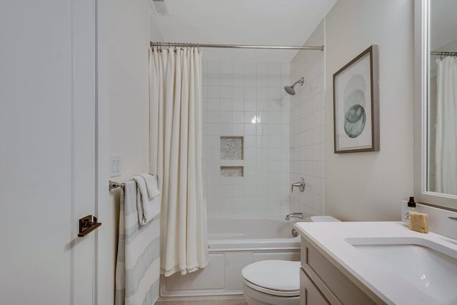 bathroom with toilet, visible vents, shower / bath combination with curtain, and vanity