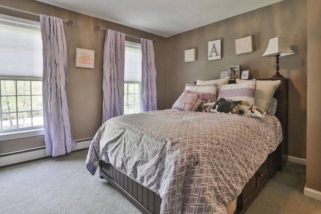 carpeted bedroom with baseboards