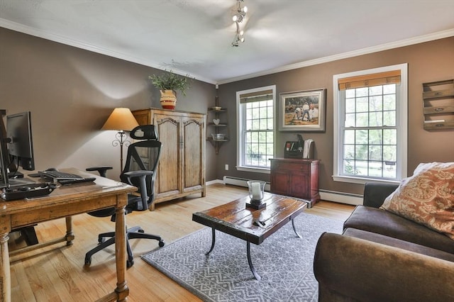 office space featuring a baseboard heating unit, light wood-type flooring, ornamental molding, and baseboards