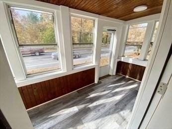 unfurnished sunroom featuring wood ceiling