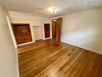 unfurnished bedroom featuring hardwood / wood-style floors