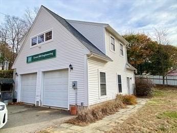 view of side of property featuring a garage