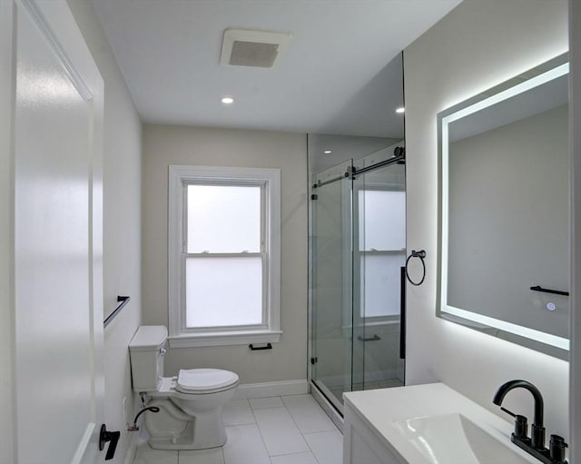 bathroom with tile patterned flooring, a shower with door, vanity, and toilet