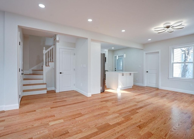 unfurnished living room with light wood-type flooring