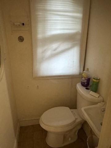 bathroom with tile patterned floors and toilet