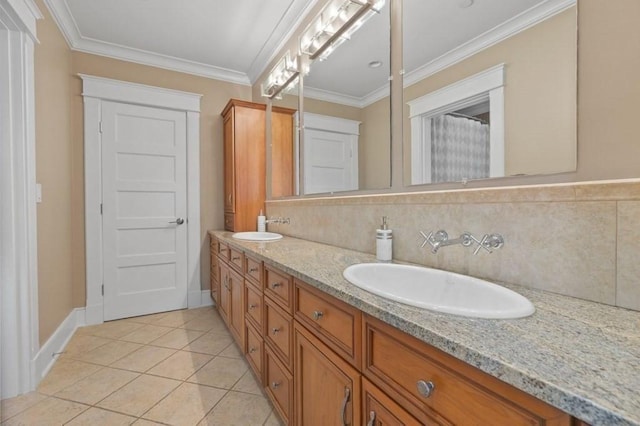 bathroom with double vanity, tile patterned flooring, ornamental molding, and a sink