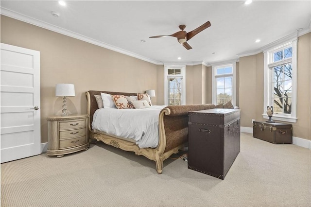 bedroom with a ceiling fan, baseboards, recessed lighting, crown molding, and light colored carpet