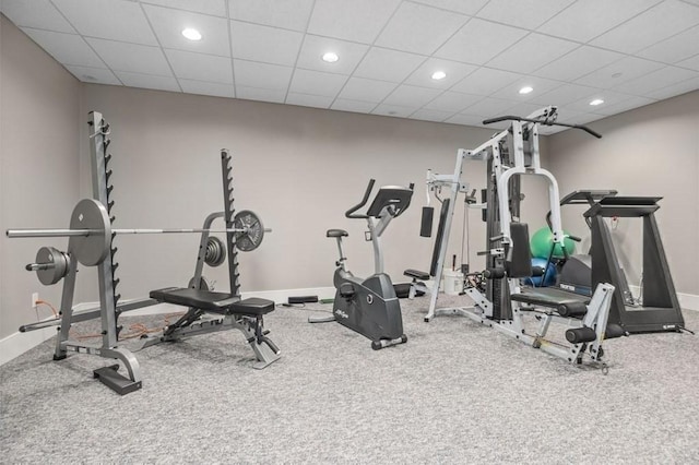 exercise area with recessed lighting, a drop ceiling, baseboards, and carpet