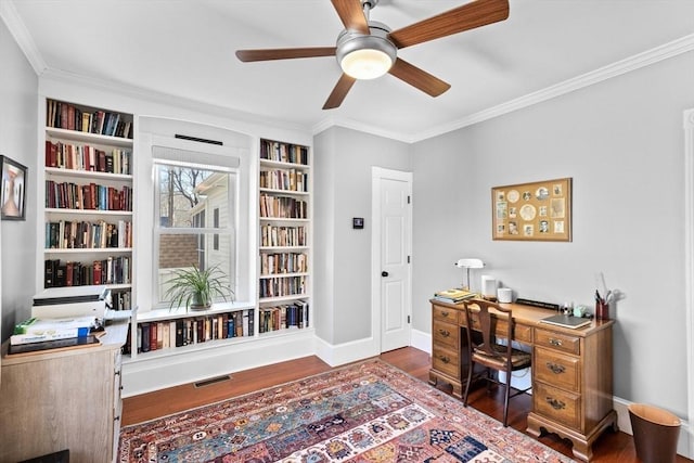 office featuring ceiling fan, wood finished floors, visible vents, baseboards, and ornamental molding