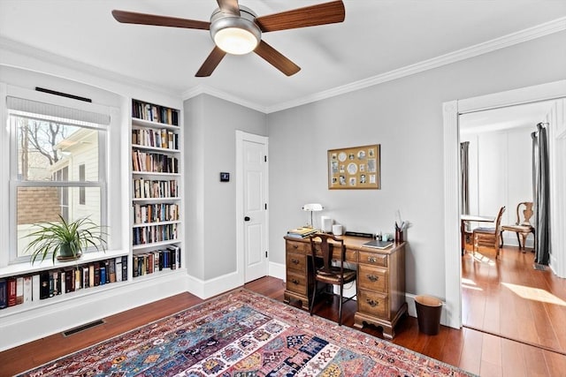 office area featuring visible vents, crown molding, baseboards, and hardwood / wood-style flooring