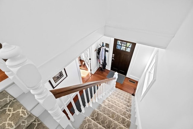 staircase with wood finished floors