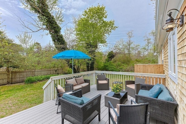 wooden terrace with an outdoor living space