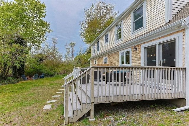wooden terrace with a yard