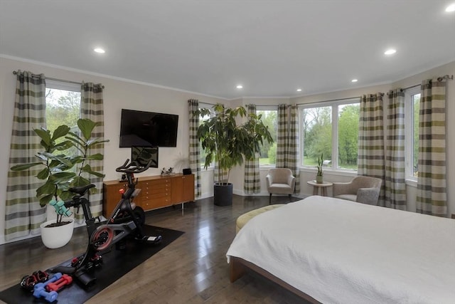 bedroom featuring ornamental molding, wood finished floors, and recessed lighting