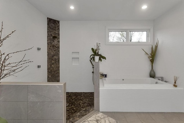 bathroom with a bath and recessed lighting