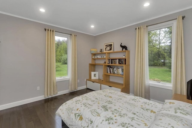 bedroom featuring dark wood-style floors, baseboards, crown molding, and recessed lighting
