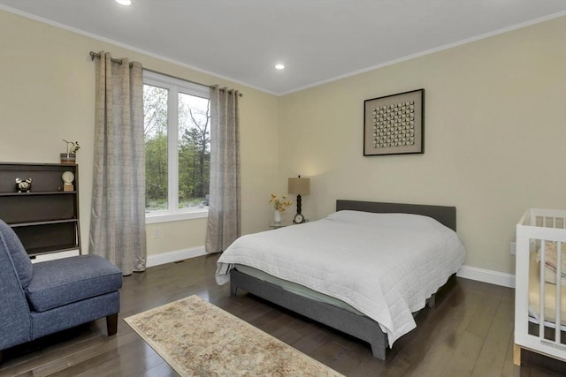 bedroom featuring baseboards, multiple windows, ornamental molding, recessed lighting, and wood finished floors