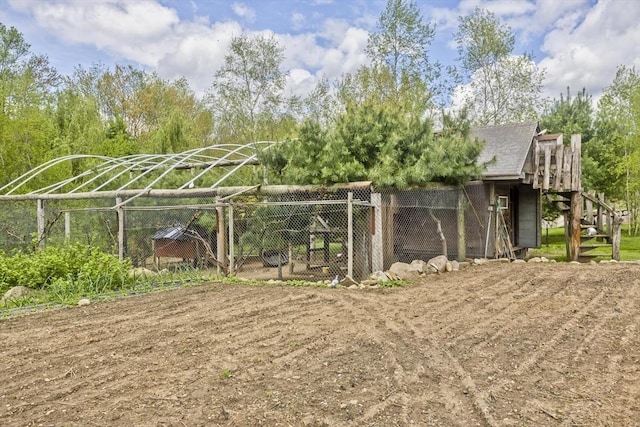 view of yard with exterior structure and an outbuilding