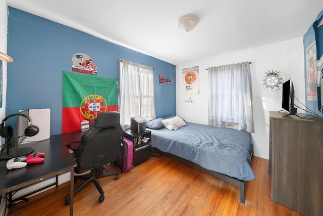 bedroom with wood finished floors