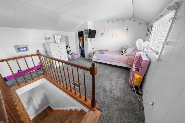 bedroom with vaulted ceiling and carpet flooring